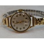 A lady's 9ct gold wrist watch by Limit having Arabic numeral dial and subsidiary seconds to circular