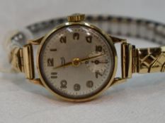 A lady's 9ct gold wrist watch by Limit having Arabic numeral dial and subsidiary seconds to circular
