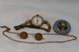 A small selection of 9ct gold and yellow metal including wrist watch, coin earrings, chain and