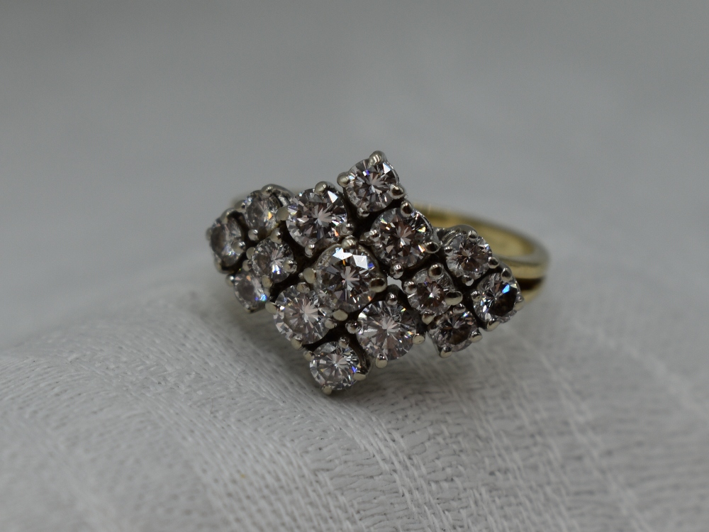 A lady's dress ring having a diamond multi cluster, total approx 1ct in a stepped claw mount to