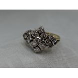 A lady's dress ring having a diamond multi cluster, total approx 1ct in a stepped claw mount to