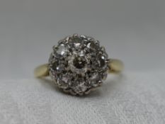 A lady's dress ring having a diamond cluster, total approx 1ct in a pave and claw set mount on a