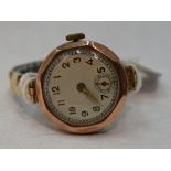 A lady's vintage 9ct gold wrist watch having Arabic numeral dial to circular face in octagonal