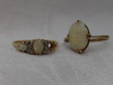 A lady's dress ring having three opals (1 missing) interspersed by diamond chips in a gallery