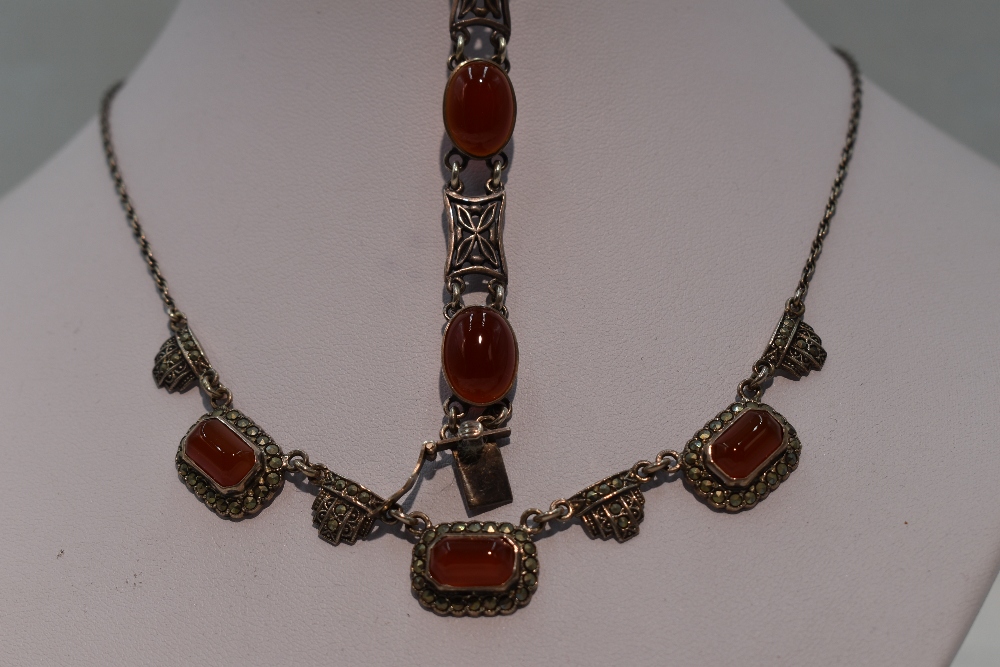 An HM silver necklace having carnelian and marcasite panels on a fixed chain, and a matched HM