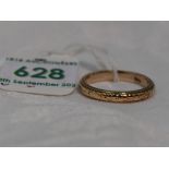 A rose gold wedding band stamped 9ct having engraved decoration, size Q & approx 3.7g