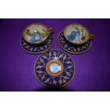 Three decorative studio pottery saucers and two cups, having a lustre finish,possibly attributed