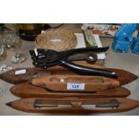 A collection of vintage wooden shuttles, a Lloyd Loom repair kit and a leather punch or similar.
