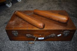 A wooden tool box or similar and a set on vintage wooden martial arts nunchucks.