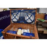 An Optima west Sussex wicker woven picnic hamper for four place settings