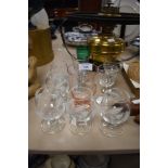 A collection of vintage glasses, including etched brandy or similar with folded foot, green