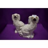 A pair of Staffordshire flat back mantel or fireside dogs.
