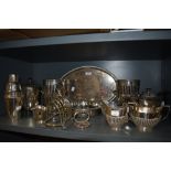 A collection of fine plated wares, amongst which are decorative trays and tea pots, champagne
