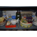 A mixed lot containing a variety of ceramics including Carlton ware, vintage tins, cat figurines and