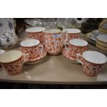 A 1880s/90s Crown Derby 'Wilmot' part breakfast set/ tea service having floral and butterfly rust