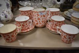 A 1880s/90s Crown Derby 'Wilmot' part breakfast set/ tea service having floral and butterfly rust