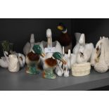 A collection of ceramic ducks and swans.