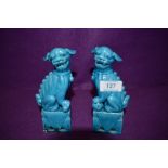 A pair of vintage Chinese Foo dogs/Guardian lions, in a vibrant Azure blue finish.