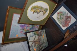 A selection of needleworks and embroidered pictures.