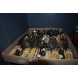 An array of mixed vintage and antique cutlery, various uses and styles.