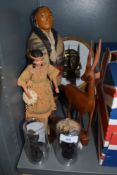 An assortment figurines and a wooden antelope and similar.