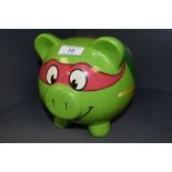 A Teenage mutant ninja turtles piggy bank.