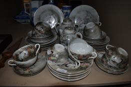 A hand decorated Japanese Egg shell tea service, having stork and floral design, plates, cups and