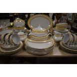 A large collection of 'waterside china' dinner service, having beige floral transfer pattern and