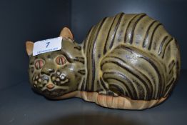 A Tremar stoneware money box in the shape of a cat.