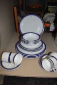 A selection of Royal porcelaine plates and cups and saucers,having blue band with gilt edging.