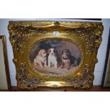 A print on board of thee pups,in reproduction gilt frame.