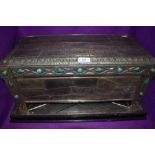 A 1930s table top casket having individual pewter panels, and green hard stone decorative detailing,