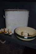 A green and white mixing bowl, a vintage enamel bread bin and several sets of novelty salt and