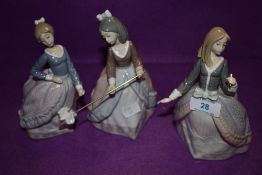Three Lladro figurines, Girl with Parasol and similar missing parasols including impressed number