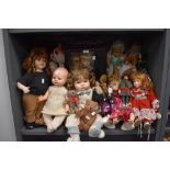 A collection of dolls, various sizes, eras and styles.