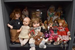 A collection of dolls, various sizes, eras and styles.
