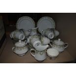 A part Noritake dinner service having muted green floral transfer pattern and silver gilt edging,