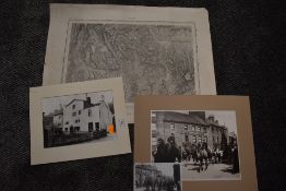 A vintage map of Kendal and mounted photographs, possibly of local interest.