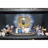 A large collection of jugs, including Wedgewood and some souvenir items, also three large platters