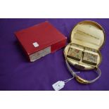 A vintage metal evening bag in box,with two internal matching compacts, comb, purse and two pockets,