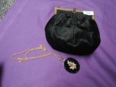A late 19th/early 20th century black velvet bag having gold tone frame and clasp,alongside a jet