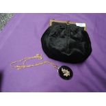 A late 19th/early 20th century black velvet bag having gold tone frame and clasp,alongside a jet