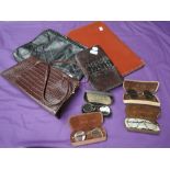 A variety of vintage handbags, including reptile and a selection of 1930s reading glasses in cases.