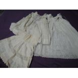 Two antique embroidered Childrens gowns, two tulle bonnets and apron,incredibly fine detail to these