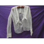 An Edwardian tulle blouse having lace and fine pin tucks to large sailor style collar and back of
