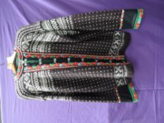 A retro wool cardigan having embroidered edging to cuffs,neck and front, larger size.