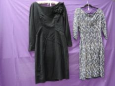 Two vintage 1950s dresses, one of black wool with Sylvia Mills label, the other in gold,navy and