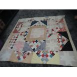 A large and colourful late antique patchwork quilt, around a double in size, some wear and marks