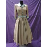 A late 1940s pale pink and blue dress, possibly a silk blend, the reverse is block coloured with a