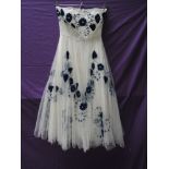 A vintage 1950s strapless layered tulle dress having blue velvet appliqué to top layer, possibly